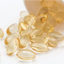 Clear Capsules Spilling Out of Bottle