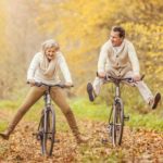 Older Couple Riding Bikes in Fall