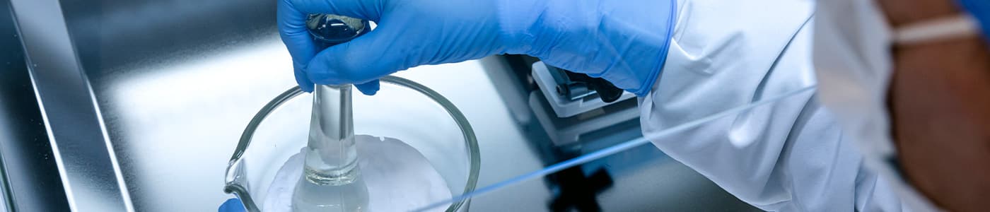 Compounding Pharmacist at work in a lab. Close up.