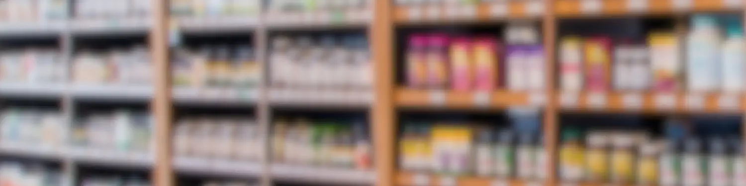 Blurred image of shelves with supplements.