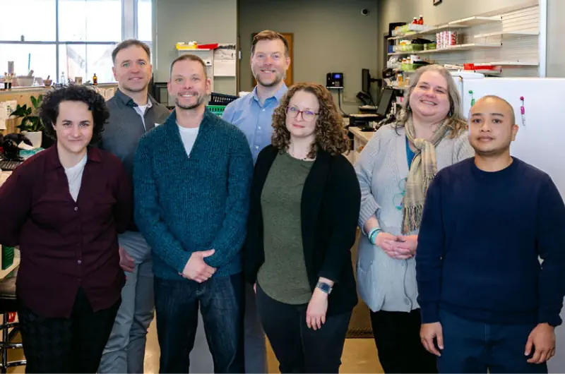 Processing group standing in front of the pharmacy.