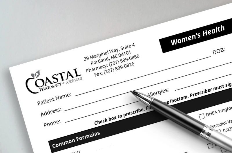 Coastal women's health prescription form with pen.