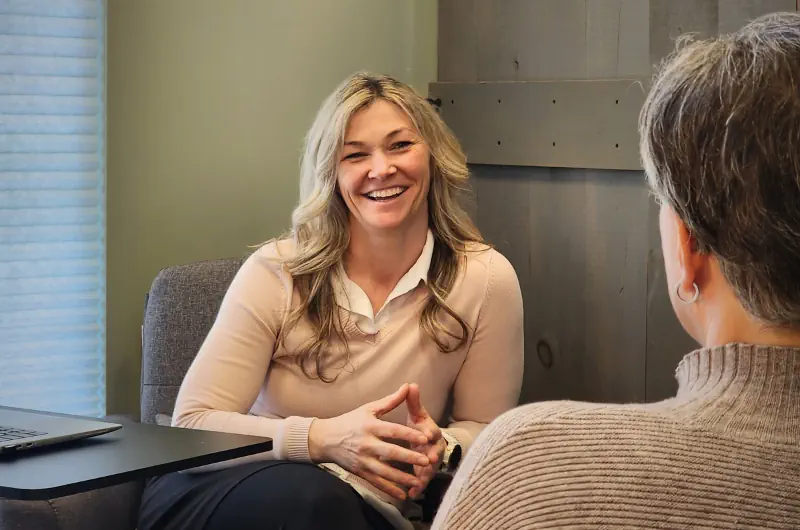 Katie Johnstone, PharmD speaking with a client.